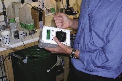 A test-bed rig is used to demonstrate water addition, in a presentation to a group of British veterinarians.