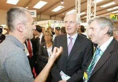 Frederic Grimaud, head of the Grimaud group, welcomes France's agriculture minister and former EU Commissioner, Michel Barnier (right) to his stand. This fast growing group now includes Hubbard selection, Grimaud Frères and Eclosion as well as farms in California and hatchery, prophylactic and therapeutic companies.