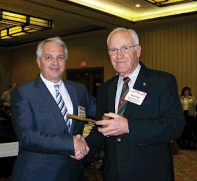 Wayne Mooney (right), AEB's 2006-07 chairman, presented Jacques Klempf with the ceremonial executive committee chairman's gavel and stepped into his ex officio position as immediate past chairman.