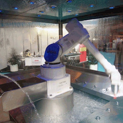 At Meatex in UK, the British distributor for Fanuc of Japan displayed a robotic arm washed constantly by jets of water from each side.