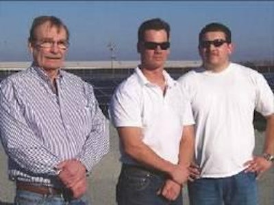 Norm Nilsen, Tim Nilsen and Ben Gutierrez are at the 'solar farm' in front of their turkey houses.