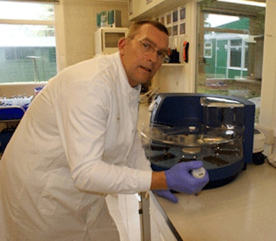 Rob Harrison of MDT prepares a bacterial culture for loading into a machine for DNA extraction.