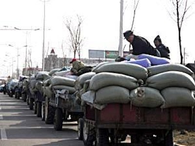 Local farmers in Heilongjiang province stood in line to sell their soybeans in early 2009.