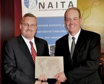 Don Hachen, left, accepts the 2010 NAITA Global Trade Award from Martyn Acreman.