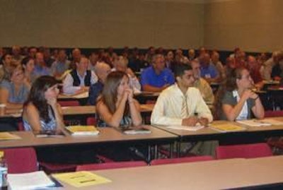 The audience listens to presentations at the 2010 NECAD.