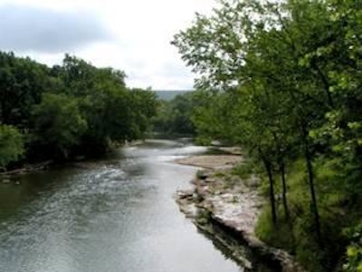 Ads paid for by the Oklahoma Tourism and Recreation Department promoted the Illinois River as one of the most scenic rivers in America.