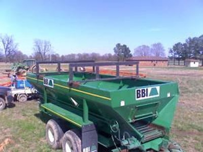 Cutters installed on a manure spreader allow for the bales to be opened and dumped into the spreader.