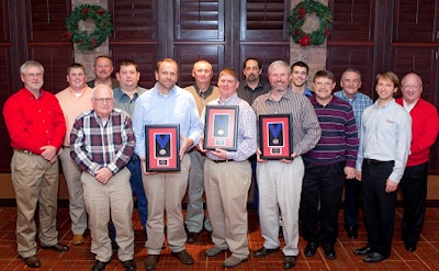 George's employees hold awards presented by Cobb500.