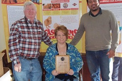 Case Farms employees display the Worker Safety Recongition Award, presented to them by the American Meat Institute