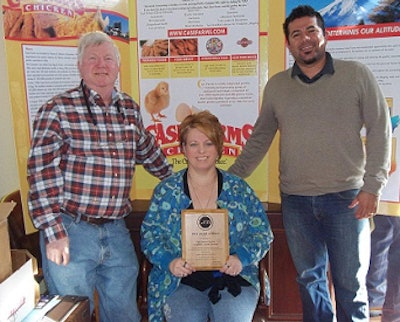 Case Farms employees display the Worker Safety Recongition Award, presented to them by the American Meat Institute