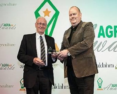 Ernst Kah, area sales manager from Marel Stork Poultry Processing, right, receives the AGRAme Award.