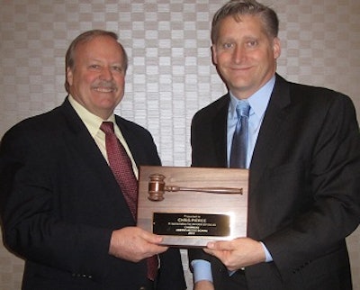 American Egg Board Chairman Roger Deffner, left, presents Immediate Past Chairman Chris Pierce with a plaque of appreciation for his service to the egg industry.
