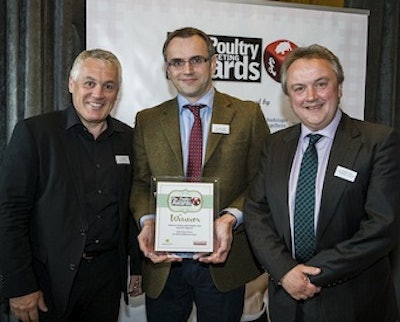 Paul Kelly, left, and Philip Regan, right, of Kelly Turkeys receive the Taste of Success Award from Andrew Loftus of Morrison’s Supermarkets.