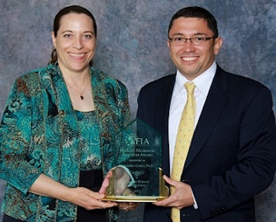 Dr. Janet Remus presents the Poultry Nutrition Research Award to Dr. Alex Corzo.