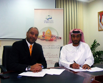Big Dutchman’s Khalid Abdelrahman, left, and Hamad Al Ameri, CEO of Al Ajban Poultry Farms, sign a contract that marks Big Dutchman’s selection to provide equipment for the Al Ajban Poultry Farms expansion.
