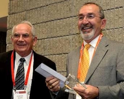From left: Charles Beard, former director of the Southeast Poultry Research Laboratory and retired vice president of research at USPOULTRY and Sarge Bilgili, professor and head of the Department of Population Health at the University of Georgia.