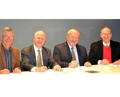 From left to right: Paul Hill, past chairman, National Turkey Federation; Mike Brown, president, National Chicken Council; James Sumner, president, USA Poultry & Egg Export Council; and John Starkey, president, U.S. Poultry & Egg Association, signing collaboration agreement while at the 2013 International Production & Processing Expo.