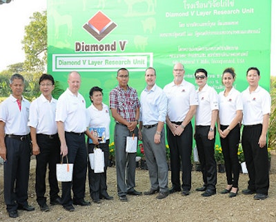 Jonathan Broomhead, third from left, shared insights on reducing pathogen stress by improving gut health during the opening ceremony of the new Diamond V Layer Research Unit.