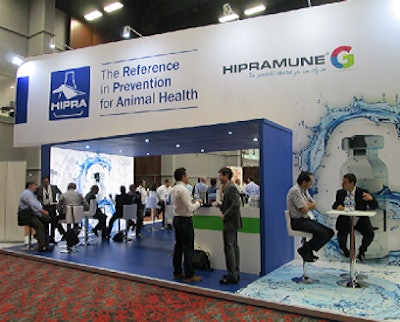 HIPRA staff members visit with customers at the 2014 International Pig Veterinary Society Congress.