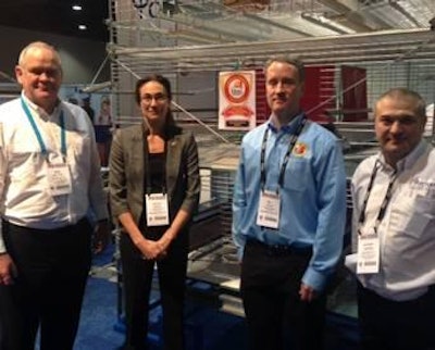 Mike Button (far left), Potters Poultry, and Anthony Harman (far right), Potters Poultry, receive the award and certificate of approval for compact aviary system from Dr. Marion Garcia (center left), chief veterinary officer, American Humane Association, and Will Gillis (center right), standards and systems manager, American Humane Association, at the recent 2015 IPPE.
