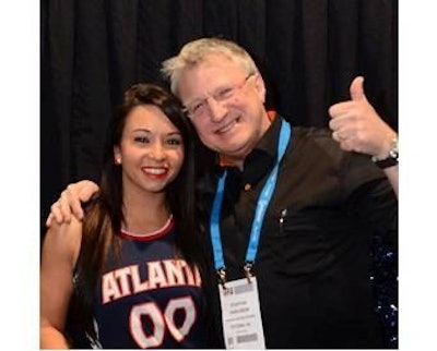 Staffan Karlsson, global manager for Sandvik Process Systems, with an Atlanta Hawks cheerleader.