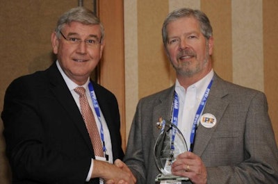 James Adams (right), president and CEO of Wenger Feeds, received the U.S. Poultry & Egg Association Lamplighter Award at the International Poultry Expo, part of the 2015 International Production & Processing Expo. He was presented with the award by outgoing USPOULTRY chairman, Elton Maddox, Wayne Farms, Oakwood, Georgia.