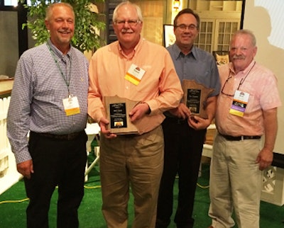 Minnesota Turkey Growers Association Allied Committee Member Dr. Jim Trites, left, presents Glenn Schulz with a Lifetime Achievement Award, while Dave Fischbach accepts his award from Committee Chairman Errol Lagred, right.