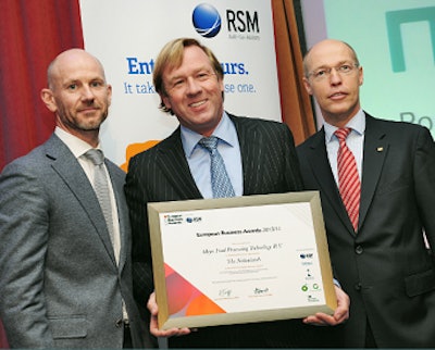 Robbert Birkhoff, center, regional sales director of Meyn, receives the official nomination of National Public Champion.