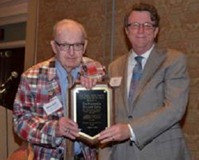 Howard Coble is presented with the North Carolina Poultry Federation Distinguished Service Award from National Turkey Federation President Joel Brandenberger.