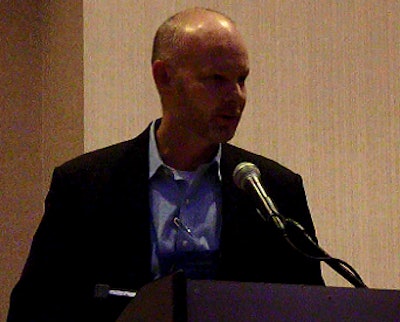 Chris Sharp, Kelly's Foods, speaks to the crowd at the National Poultry & Food Distributors Association annual convention after accepting the 2014 member of the year award.