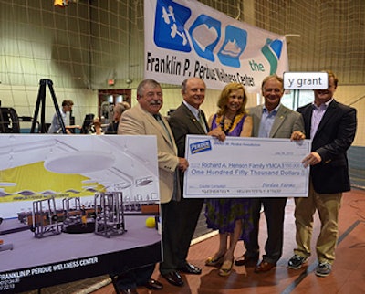 Perdue Farms officials present a $150,000 check to the Richard A. Henson Family YMCA in Salisbury, Md.