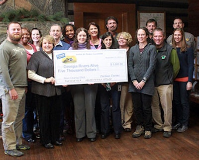 Melissa Molaison, Perdue environmental manager in Perry, Ga., presents a $5,000 grant funded by the Arthur W. Perdue Foundation to members of the Georgia Rivers Alive Board of Directors.