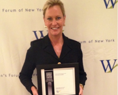 Sara Lilygren, executive vice president of corporate affairs for Tyson Foods, accepts an award for women's diversity.