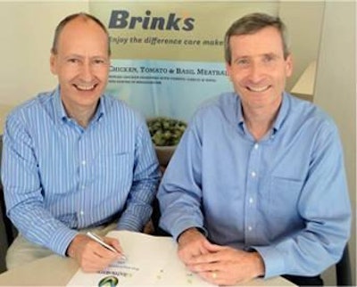 Jim Johnston of MTech and John Timms of Van Den Brink Poultry signed an agreement between the two companies.