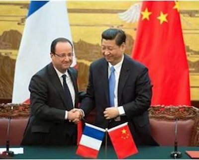 French President François Hollande and Chinese President Xi Jinping oversaw the pig farm agreement.