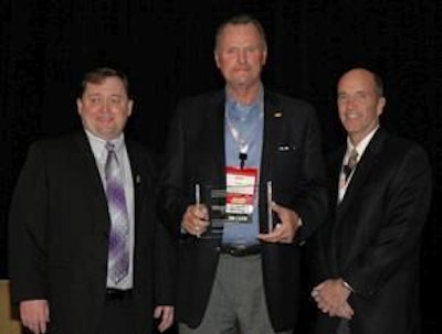 Kerry Doughty, center, executive vice president of sales and marketing for Butterball, accepts a Turkey on the Menu award on behalf of Wegeman’s Food Markets. Also pictured are Carl Wittenburg, president of Protein Alliance Inc., and Jim Leighton, president, retail, turkey and international, Perdue Farms.