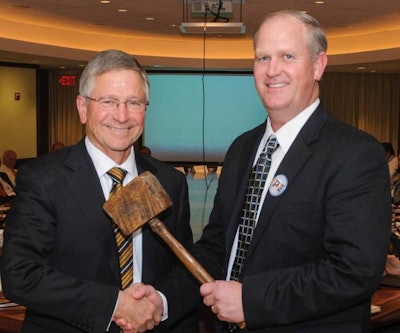 Paul Hill was presented with the “working man’s gavel” by Sherman Miller, the 2015 chairman. | USPOULTRY