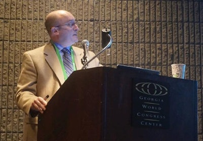 Dr. Randall Singer, a professor of epidemiology at the University of Minnesota’s Department of Veterinary and Biomedical Sciences, speaks at the International Processing & Production Expo in Atlanta on Tuesday, Jan. 26, 2016. Photo by Austin Alonzo.