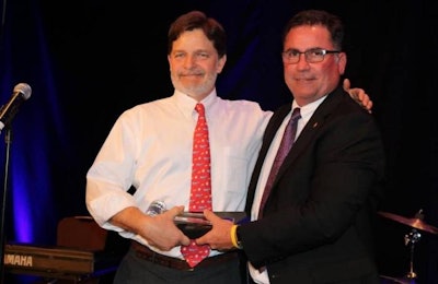 New USA Poultry & Egg Export Council Chairman Steve Monroe of Sanderson Farms, right, receives the ceremonial gavel from outgoing Chairman Jim Wayt of Intervision Foods. | USAPEEC