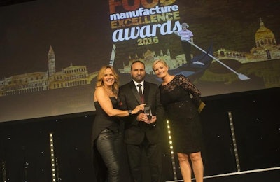Sajad Ahmed from Moy Park’s Ashbourne Training Team, center, accepts the Training Program of the Year award at the Food Manufacture Excellence Awards presenters Carole Smilie, left, and Alex Bebbington. Moy Park is encouraging recent graduates to apply for the program. | Moy Park