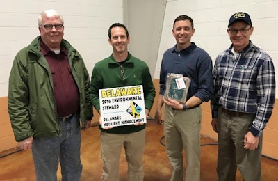 Delaware Secretary of Agriculture Ed Kee, left, congratulates poultry growers Ted Layton and Scott Willey on receiving the Delaware Environmental Stewardship Award during Delaware Ag Week. Also joining them is Ed Jewell, housing manager for Allen Harim. | Courtesy of Allen Harim