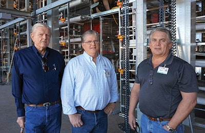 Hickman’s Egg Ranch Founder Bill Hickman, left, President Glenn Hickman, middle, and Vice President Billy Hickman, right, pose in an under-construction cage-free layer house. | Austin Alonzo