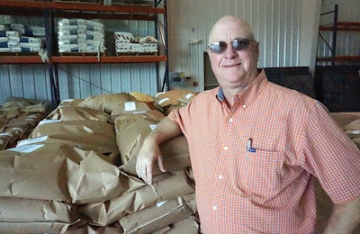 Mitchell Pate, director of Auburn University’s Poultry Research Unit, stands by bagged feed manufactured at the Poultry and Animal Nutrition Center. | Jackie Roembke