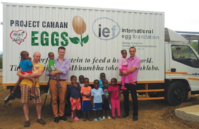 Aaron Law of Egg Farmers of Canada, Julian Madeley of IEF, and Dr. Magdy Abdelrahman of Lohmann Tierzucht with children from the Heart for Africa Project Canaan. | Courtesy IEF
