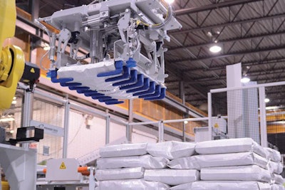 Robotic palletizers can increase production and decrease the risk for on-the-job injuries. | Premier Tech