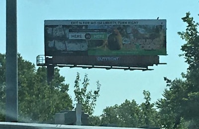 A billboard near a busy interstate in the Kansas City metro area asks consumers if they prefer to get their eggs from hens living in cages or on pastures. | Austin Alonzo