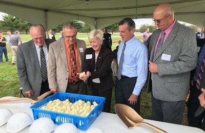 From left, Reps. Dave Wilson and Rich Collins, share a laugh with Reps. Ruth Briggs King, Gov. John Carney and Sussex County Council President Michael Vincent as they look at baby chicks at a groundbreaking ceremony for a new Allen Harim hatchery in Dagsboro. | Allen Harim