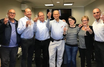 From left, Ofer Borovsky, Daniel Stern, Gilad Agmon, Meir Toshav, Holly Gonzales, Amalia Lev and Steve Kronengold celebrate Plasson's acquisition of a 30 percent stake in Diversified Imports, which has been renamed Diversified Agriculture. | Diversified Agriculture