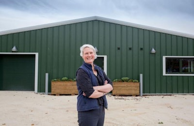 Dr. Emily Burton, head of Nottingham Trent University's poultry research unit, stands outside of the new facility. | Nottingham Trent University