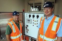Regional Environmental Manager Kevin Milner and Complex Environmental Manager Thomas Percer at the upgraded stormwater lift station pump controls located near the cooling sheds. | Image courtesy of Pilgrim's Pride Corp.